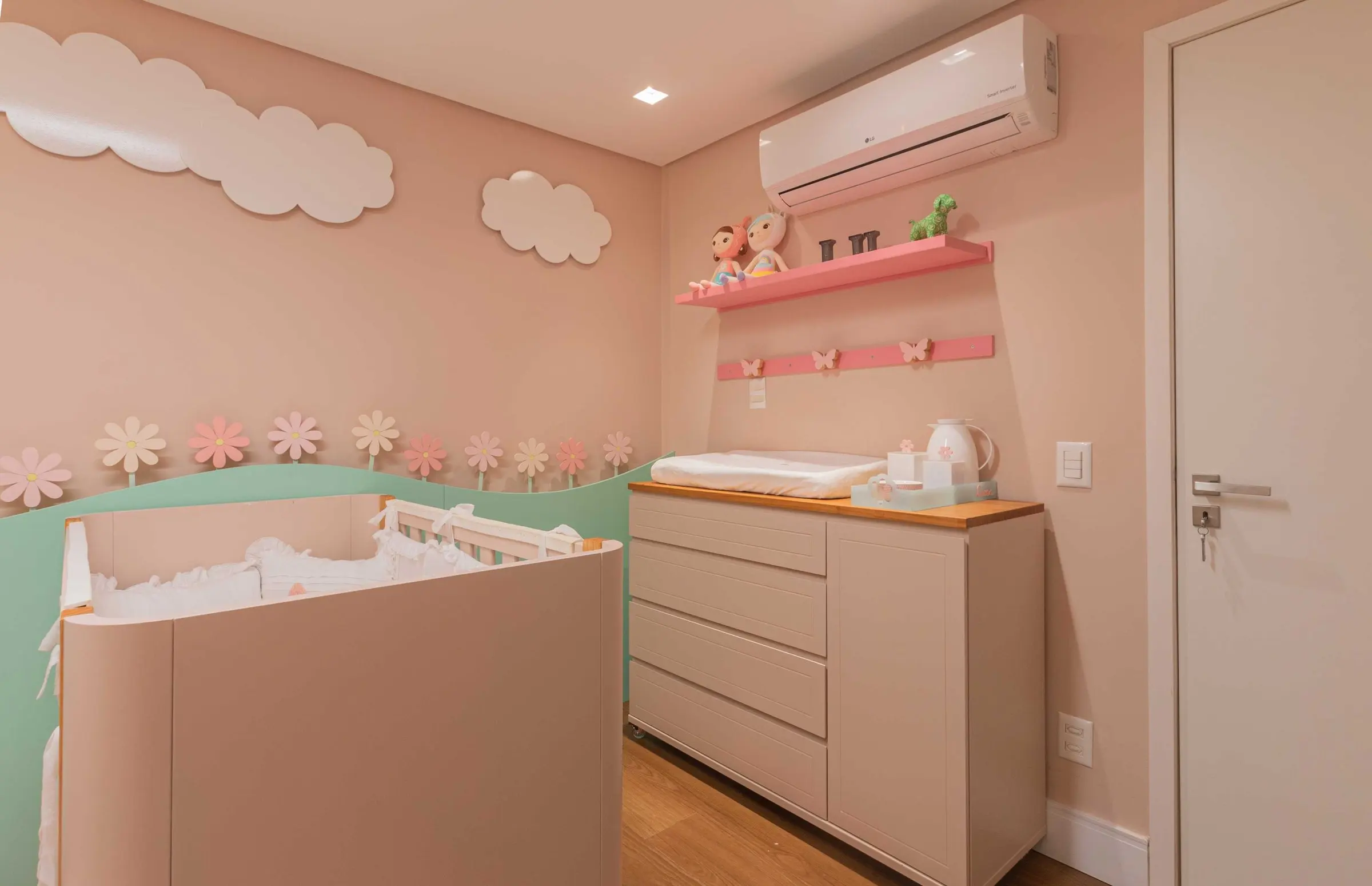 Changing dresser and shelves with soft toys