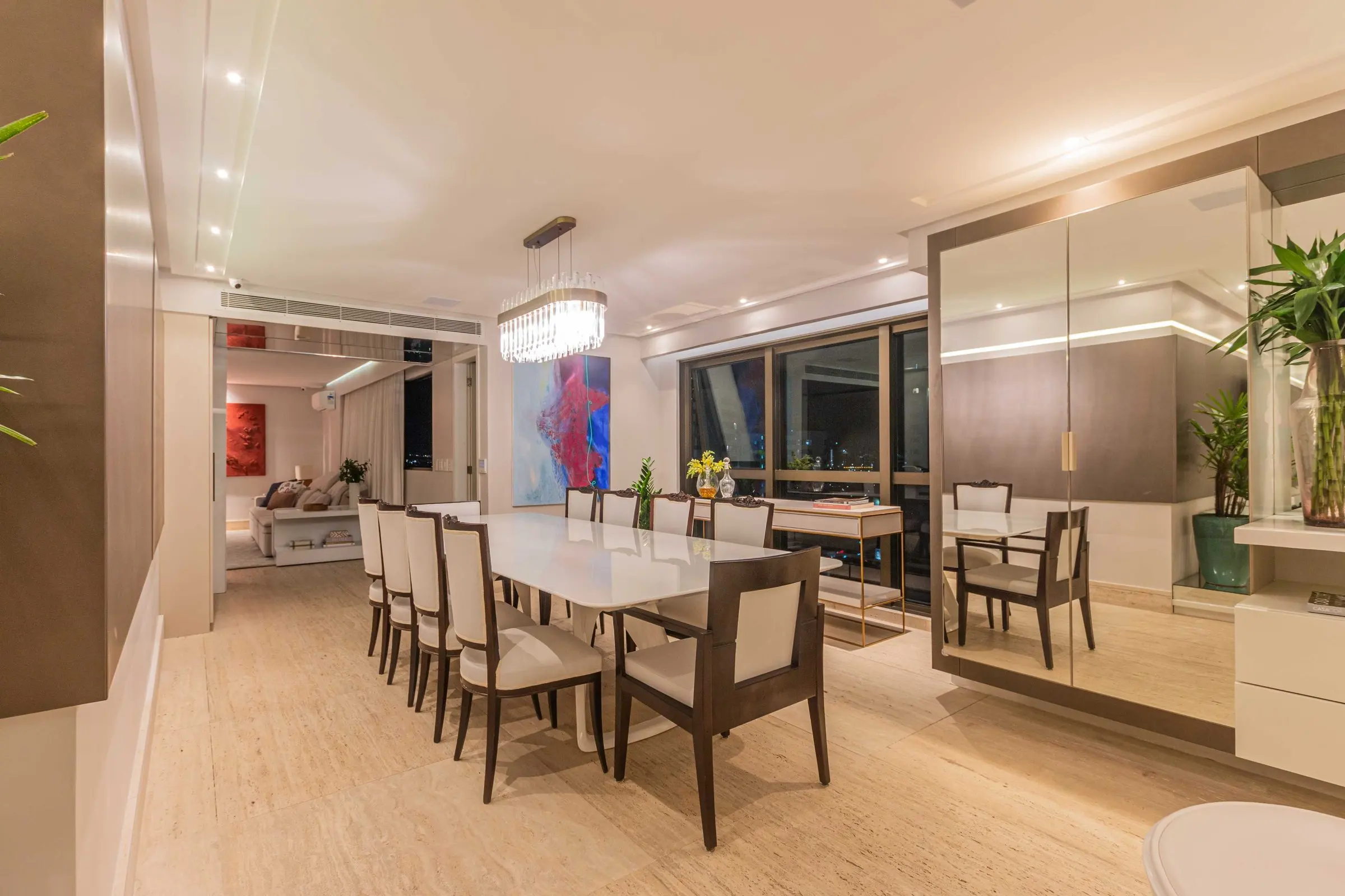 Dining room with a white table and mirrors