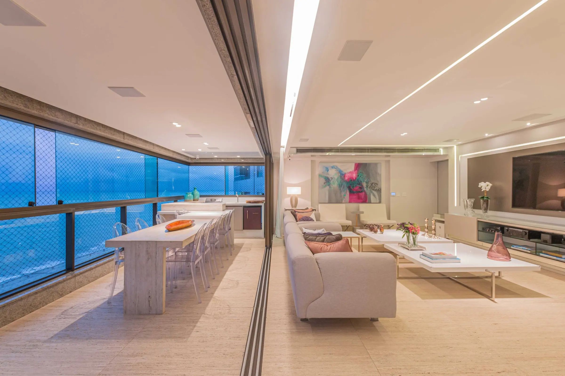Balcony with a long table and a sea view